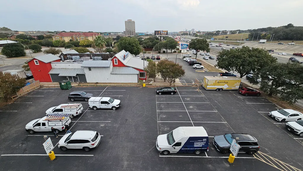 Overhead view of the parking lot showing open guest parking spaces